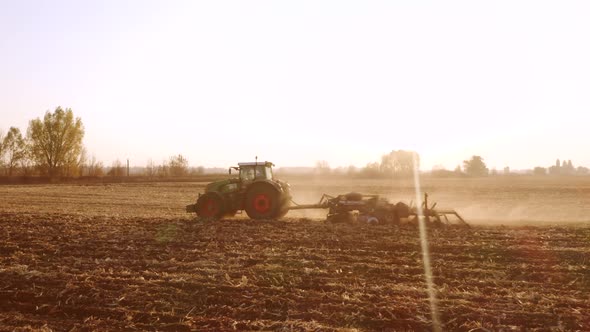 Tractor Working on Field on a Sunny Day