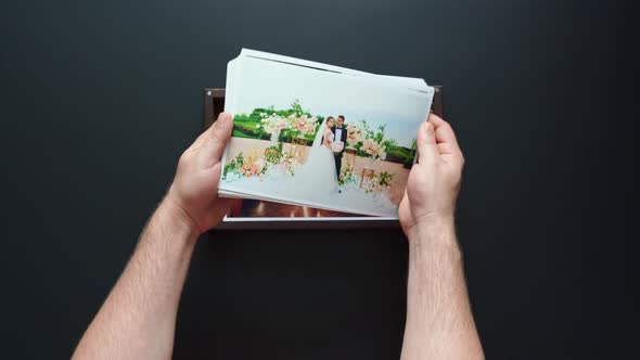 the Photographer Puts Wedding Photos and a Flash Drive in a Box