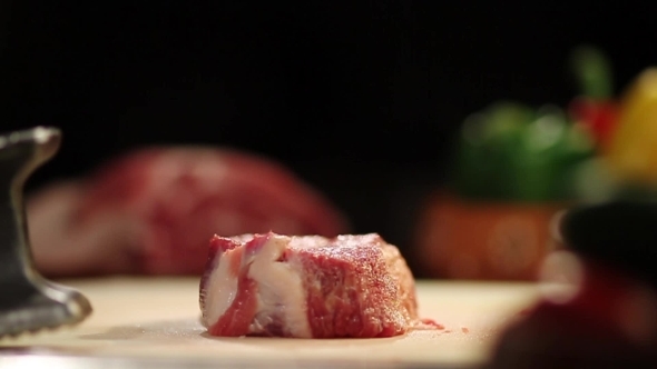 Man's Hand Beat Off Meat On Table By Hummer