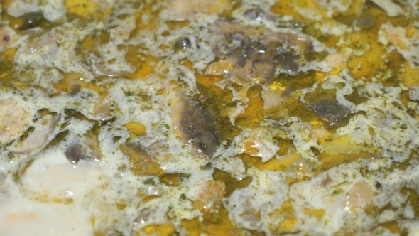 Preparation Of Mushroom Soup In a Saucepan On The Stove