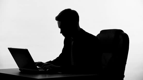 Press Secretary Silhouette Typing Government Statement, Man Working on Project