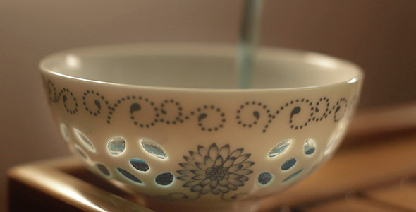 Thailand Blue Tea is Poured into a Porcelain Bowl 03