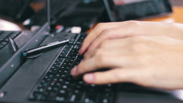 Using Computer Laptop on Wooden Desk