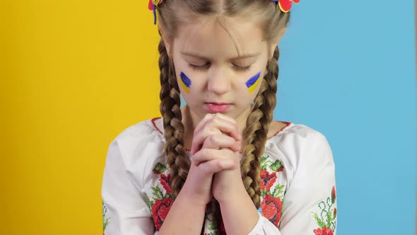 War in Ukraine. Ukrainian Child against war. Praying child.