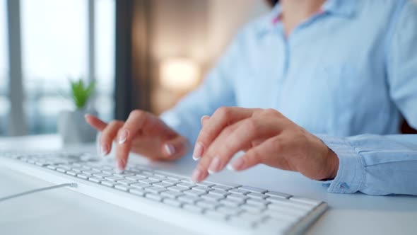 Female Hands Typing on a Computer Keyboard