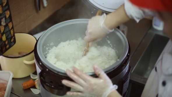 The Chef Mixes the Cooked Rice