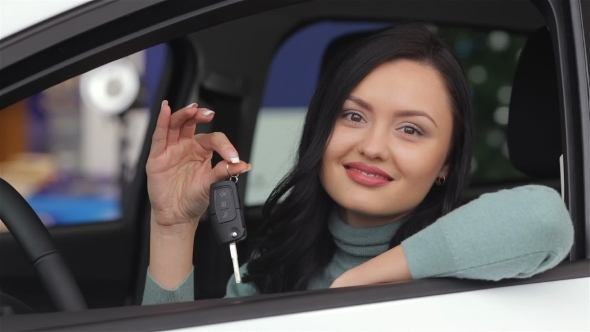 Smiling Woman Showing The Car Key