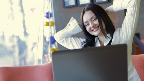 A Young Business Woman Using Her Laptop