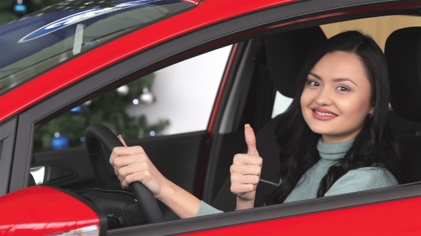 Buyer Woman Doing Thumps-up In Car