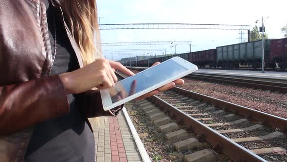 Woman At The Station Using The Touchpad