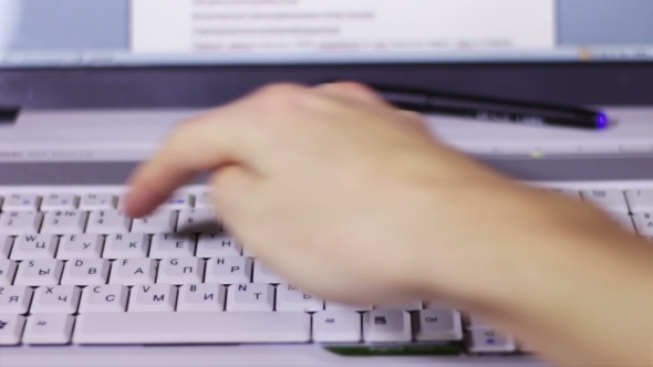 Typing On a White Computer Laptop Keyboard