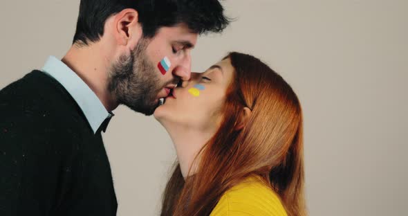 Couple with Russian and Ukraine Flag are Kissing Concept of Peace and Stop War