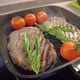 Cooking Steak with Rosemary and Cherry Tomatoes on the Grill - VideoHive Item for Sale
