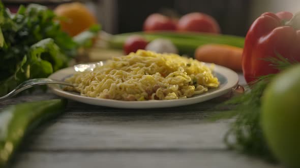 Plate with Noodles Amidst Raw Vegetables