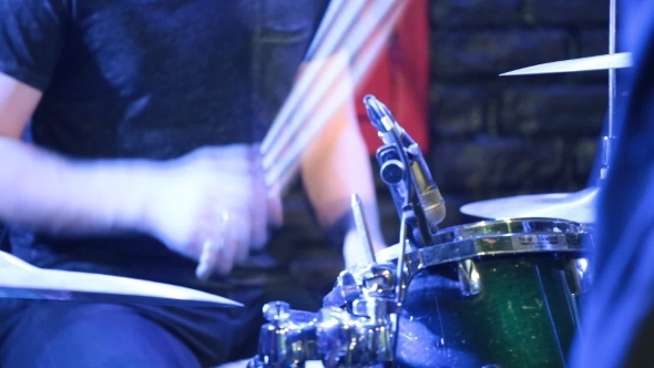 Man Playing Drums At Concert