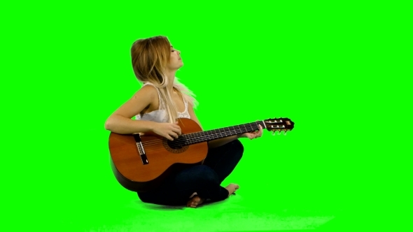 Young Woman Playing Guitar
