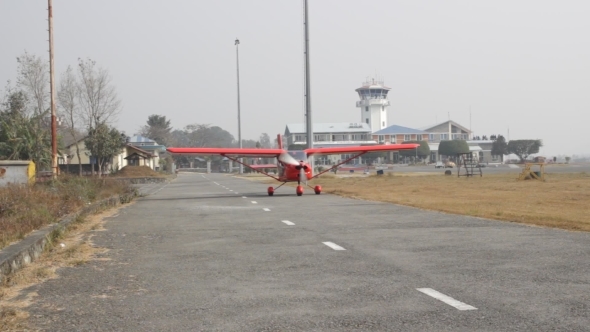 Small Airplane Taxiing From The Runway