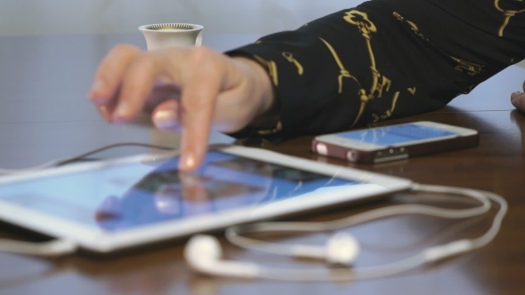 Woman Works on a Project Using Digital Tablet