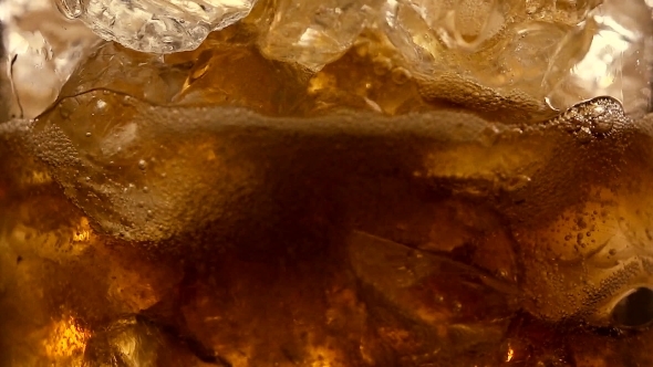 Refreshing Brown Soda With Ice Cubes And Bubbles