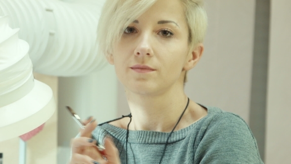 Nail Master Woman Look At Camera In Salon