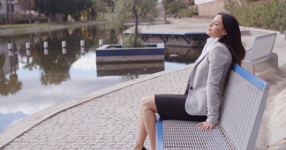 Business Woman Relaxing Near Canal
