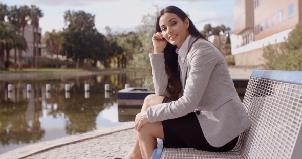 Gorgeous Business Woman Sitting On Bench