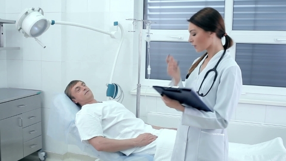 Doctor Talking To a Patient During Bypass alt