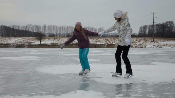 Young Girlsice Skating On Frozen Lake