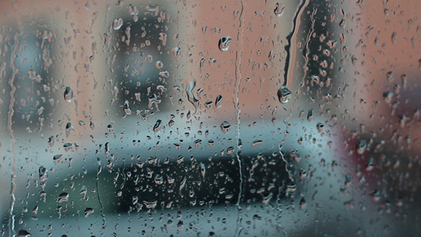 Raindrops Running Down The Glass