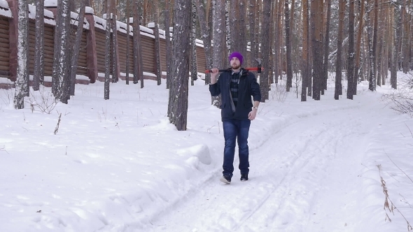 Lumberjack With His Ax Returns From Work Of The Winter Forest