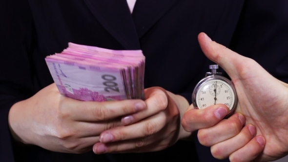Business Women Counts Money And Stopwatch.