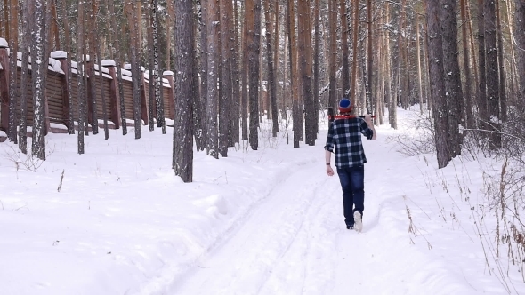 Lumberjack With His Ax Returns From Work Of The Winter Forest