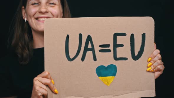 Girl Holds Poster and Rejoices That Ukraine is a Candidate of the European Union