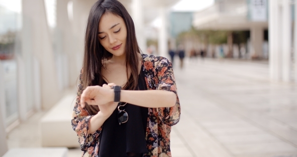 Young Woman Checking Her Wristwatch