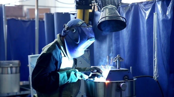 Metalworker Welder Operates With Metall Sheet