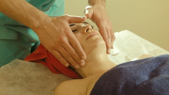 Male Doing Massage To Female In Spa Salon