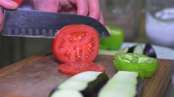 Chef Hands - Cutting Tomato and Pepper in the Kitchen