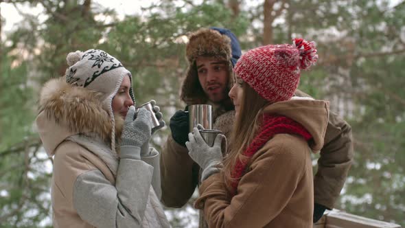 Tourists Drinking From Thermo Cups