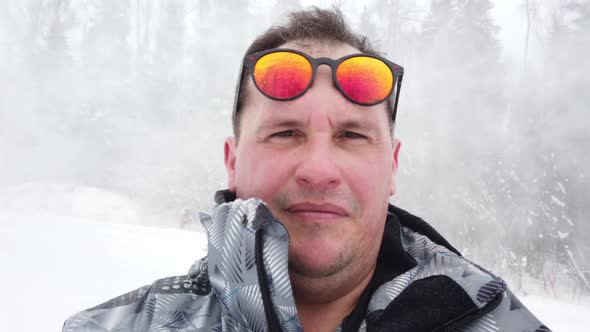 Man Stands Alone Against White Snowstorm and Snow Storm a Snowfall