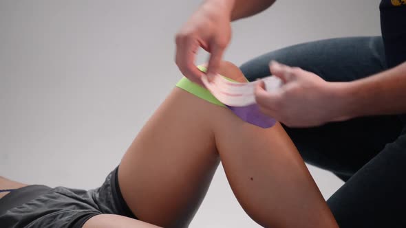 Kinesio Tape on the Girl's Knee