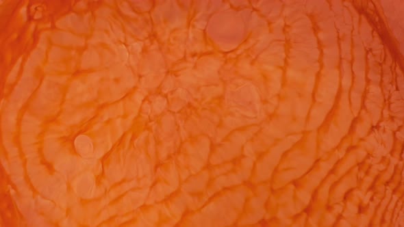 Closeup Orange Paint in Motion Abstract Background