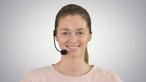 Pretty female support center operator with headset smiling