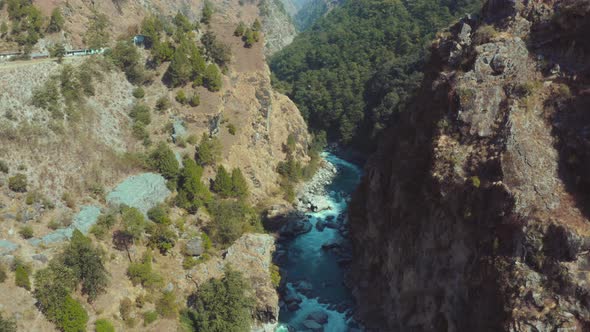 Beautiful Bhagirathi River flowing mid of two huge mountain rocks in Uttarkashi, Uttarakhand, India