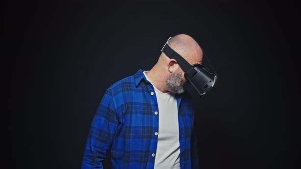 Caucasian Man Using VR Goggles