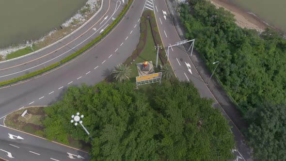 Aerial drone shot slow tilt reveal of Macau skyline and Praia Grande bridge