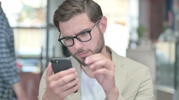 Young Man Using Smartphone
