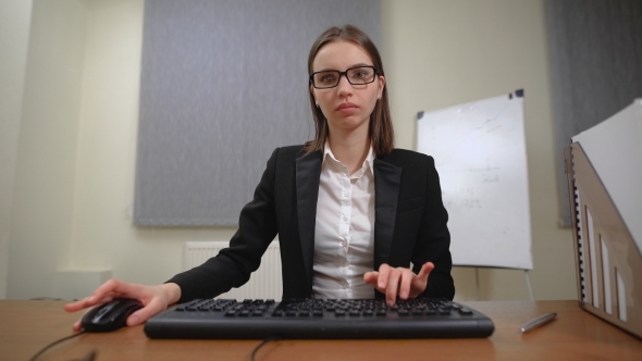 Pretty Business Woman At Office Desk