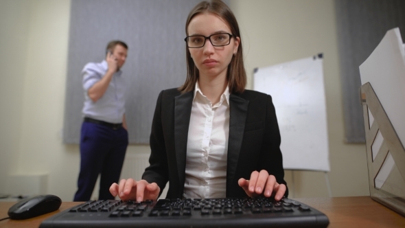 Pretty Business Woman At Office Desk