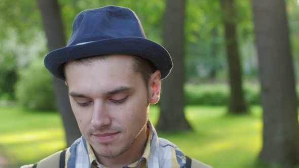 Portrait of Boy in Hat Showing Shyness, Timid Summer