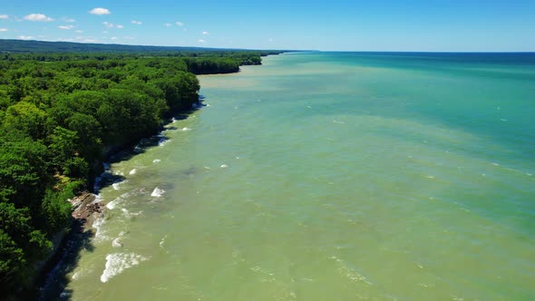 Spectacular Aerial drone video footage of beautiful Lake Erie during summer on a sunny day